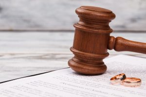 close up judge gavel and wedding rings 2023 11 27 05 02 39 utc min