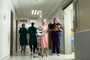 happy diverse female doctor and senior female pati 2023 11 27 05 17 29 utc min